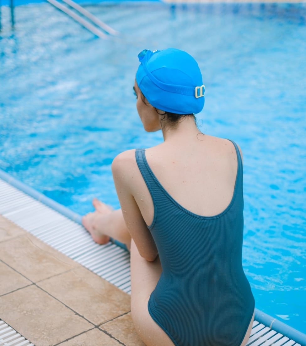 girl sitting by the pool